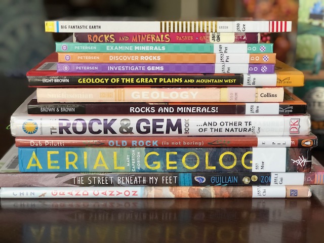 Stack of library books on earth science 